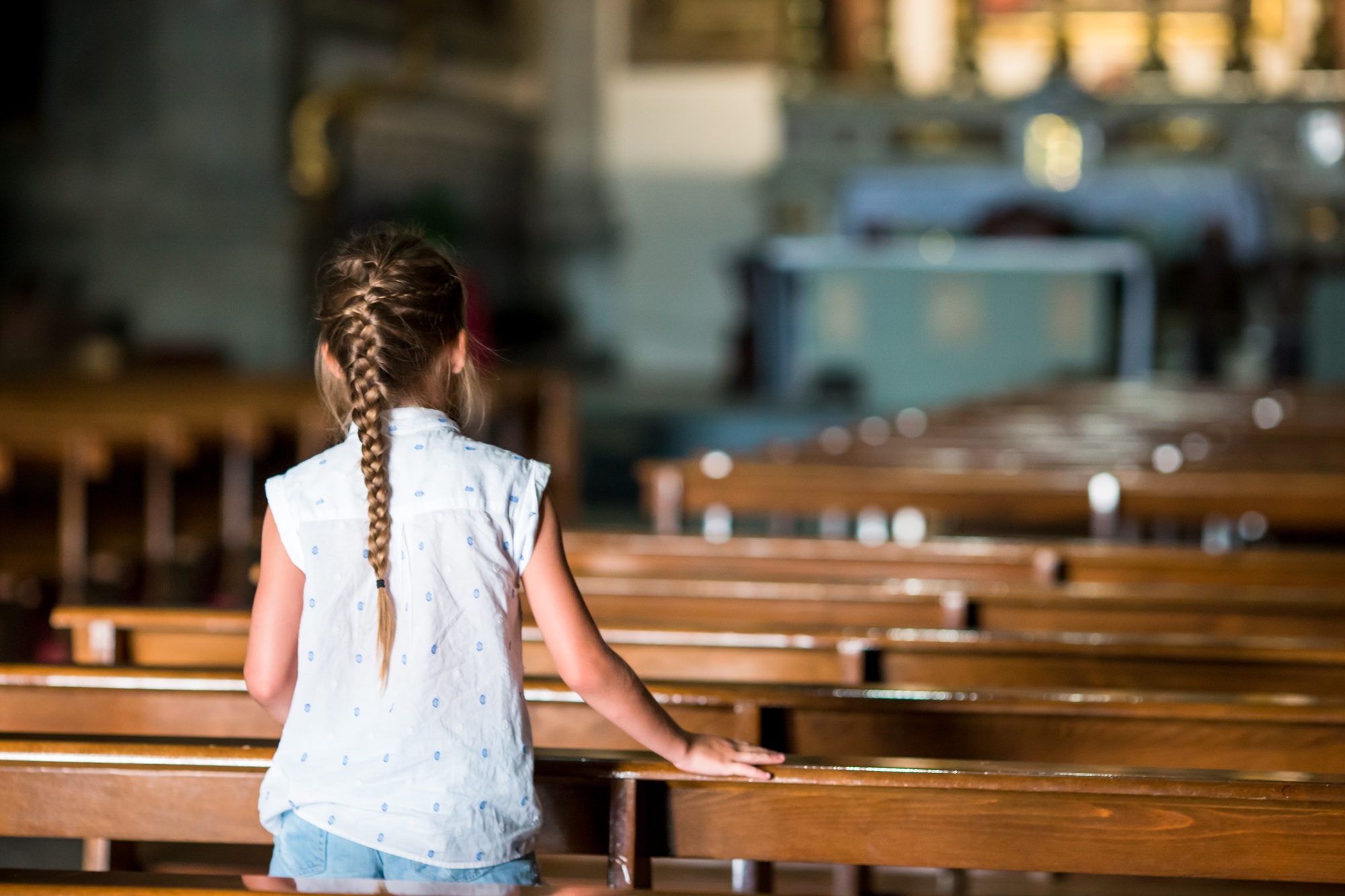 Child in beautiful old church in small italian city